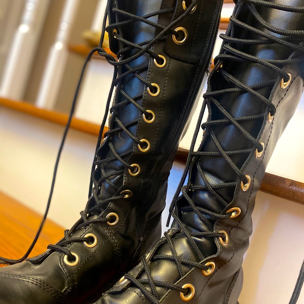 Black, knee-high, lace-up military boot